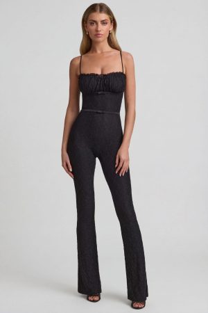 Bow-Detail Lace Flared Jumpsuit in Black
