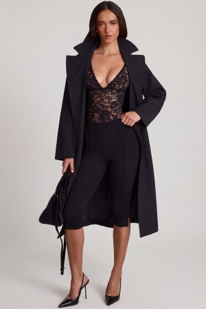 Sheer Lace Scalloped Plunge-Neck Bodysuit in Black